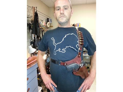 Chest holster rig, with a sliding ammo pouch
