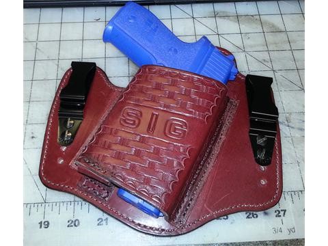 Inside the pants, clip on, hand tooled holster