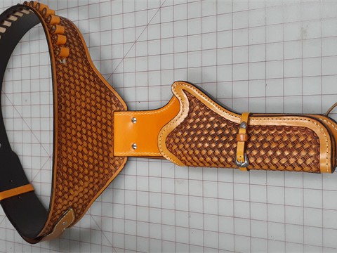 Hand tooled drop loop gunbelt with bullet loops and left hand holster